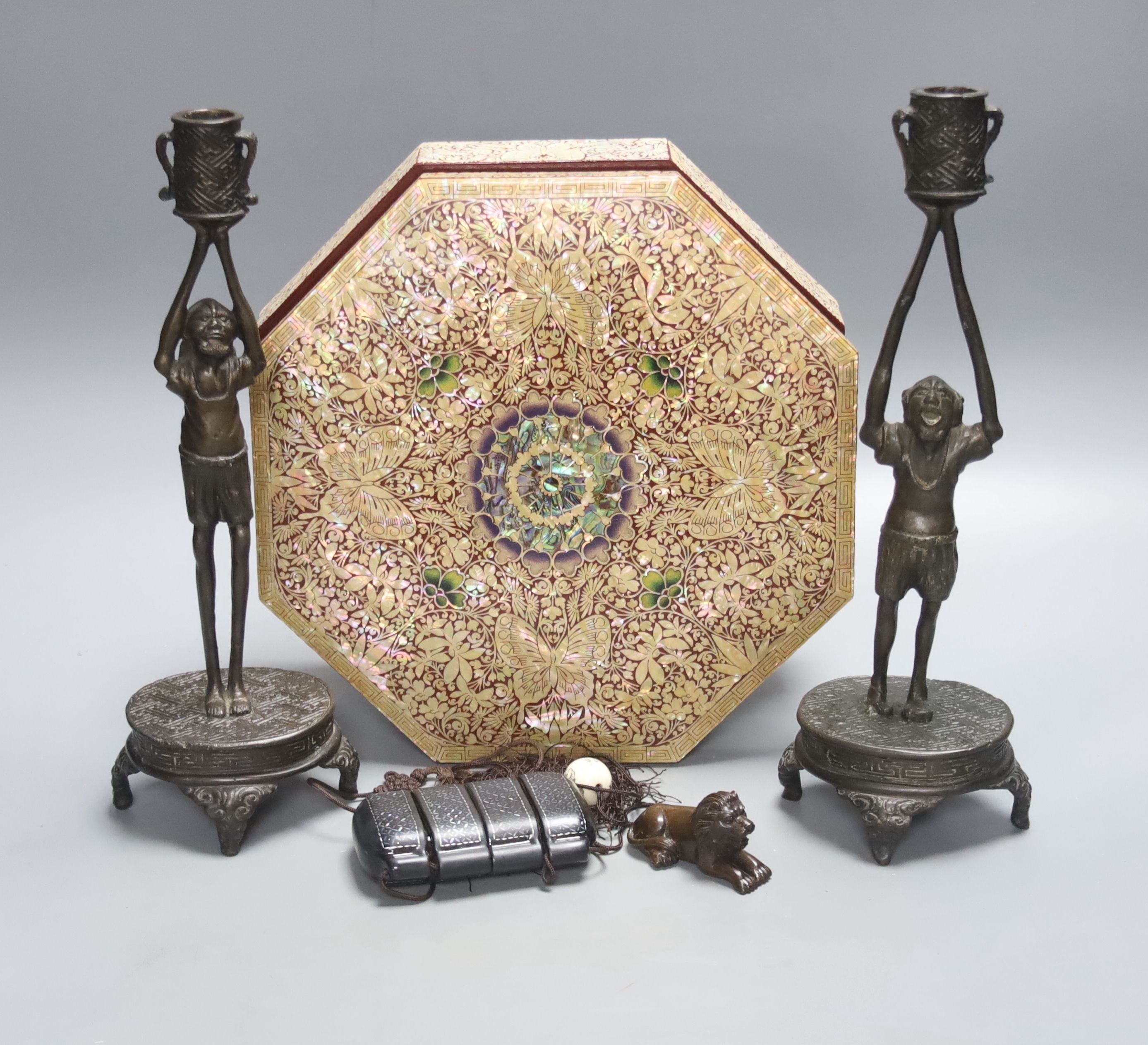 A pair of Japanese ‘Ashinaga’ and ‘Tanaga’ bronze candlesticks, a lacquer and mother-of-pearl inlaid inro and a modern mother-of-pearl and lacquer sectional box and cover